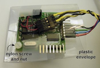 Devantech speech module protected by a plastic envelope.