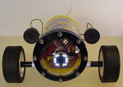 Robot with a pair of rear-mounted speakers.