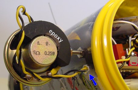 Semi-circle speaker mount epoxied and screwed in place on a robot.