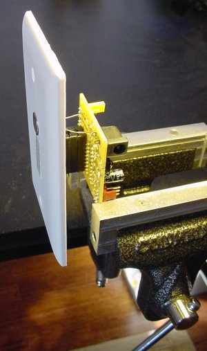 The photoresistor is the last piece soldered to the motherboard, after the proper distance has been determined by the number of DIP sockets needed to match the wall board thickness.