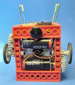 Maxon RE 16 mm gearmotors balanced on both sides of the centered wheels. Does the robot&rsquo;s frame look askew to you? Must be the camera, because the joints are square in reality.
